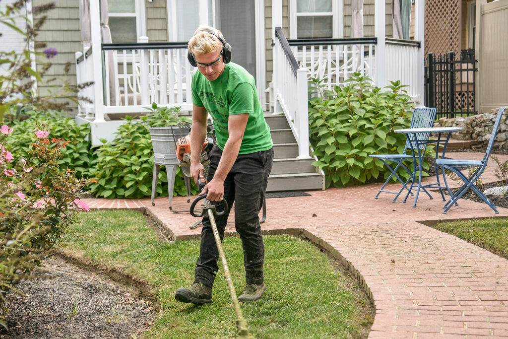 A landscaper tending to a yard